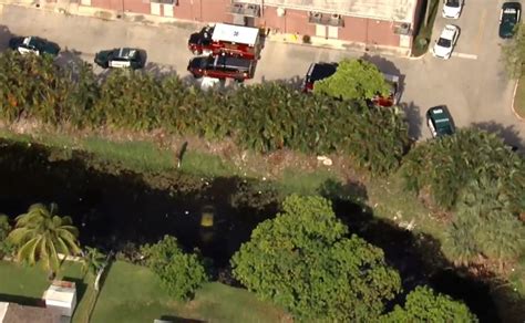 BSO deputies and firefighters respond to vehicle submerged in Lauderdale Lakes lake; No occupants found